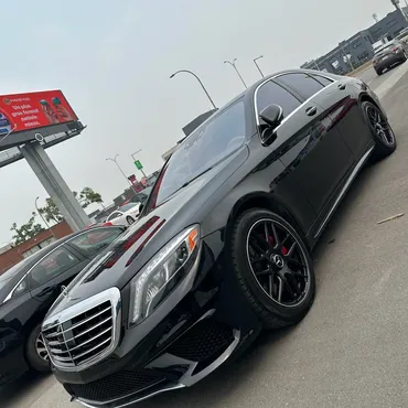 Black executive sedan in motion